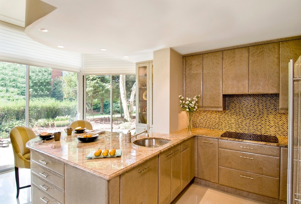 This is an example of a classic kitchen in Boston with a submerged sink, flat-panel cabinets, beige cabinets, granite worktops, multi-coloured splashback, mosaic tiled splashback, stainless steel appliances and beige floors.