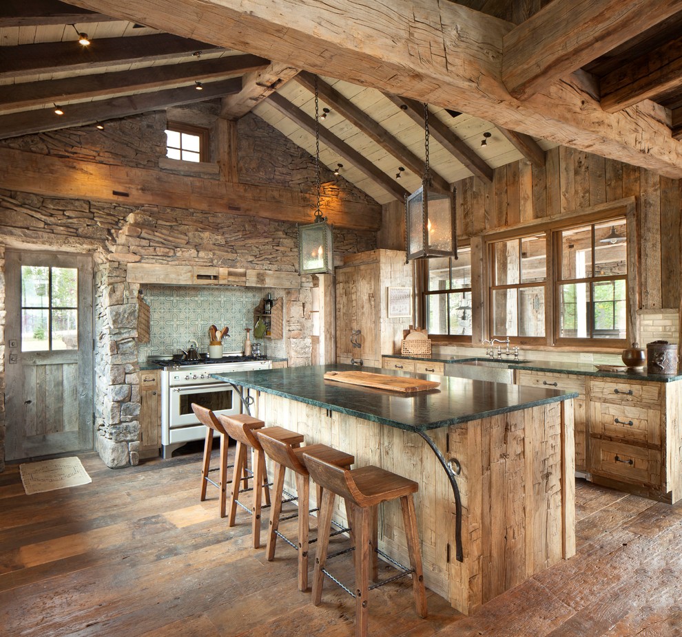 Photo of a large rustic l-shaped kitchen in Other with a belfast sink, flat-panel cabinets, distressed cabinets, marble worktops, multi-coloured splashback, cement tile splashback, stainless steel appliances, dark hardwood flooring and an island.