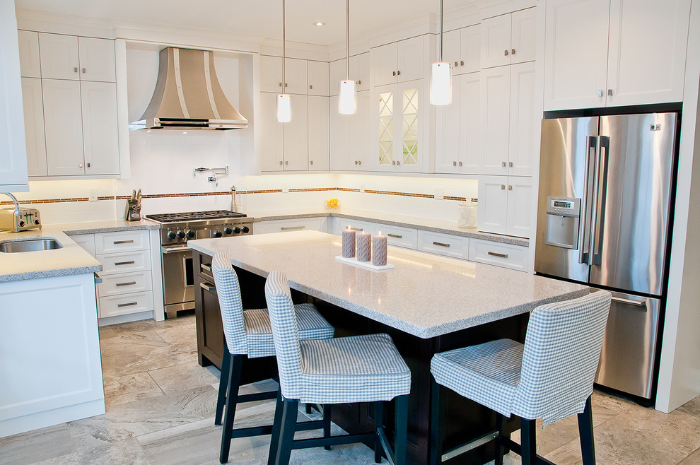 Large transitional u-shaped ceramic tile and beige floor eat-in kitchen photo in Toronto with white cabinets, white backsplash, subway tile backsplash, stainless steel appliances, an island, an undermount sink, recessed-panel cabinets and quartz countertops