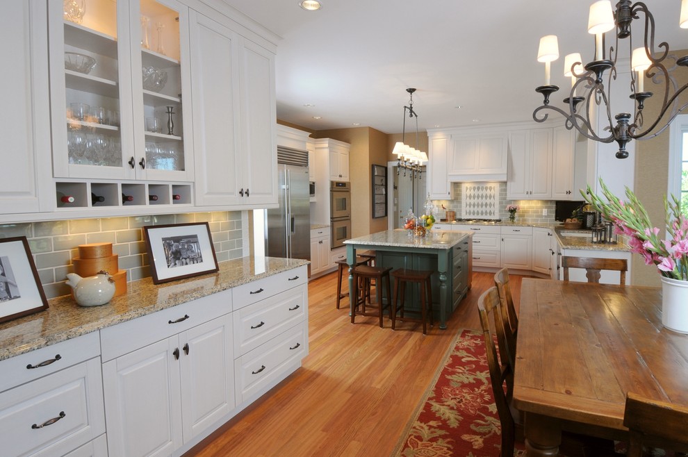 Inspiration for a traditional kitchen in Other with glass-front cabinets and stainless steel appliances.