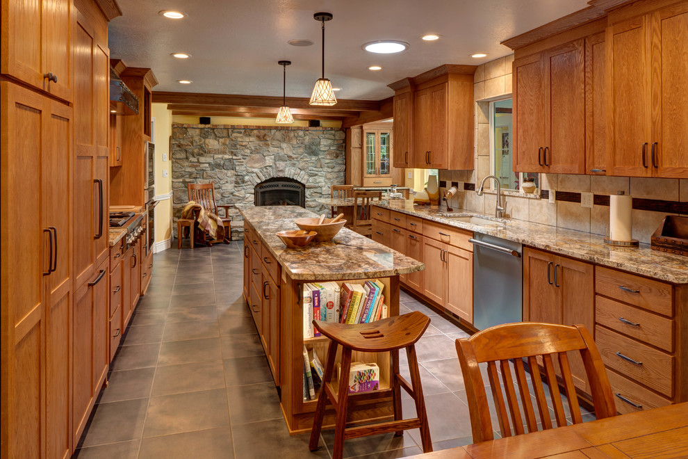 Eat-in kitchen - rustic galley eat-in kitchen idea in Salt Lake City with an undermount sink, shaker cabinets, medium tone wood cabinets, beige backsplash and an island