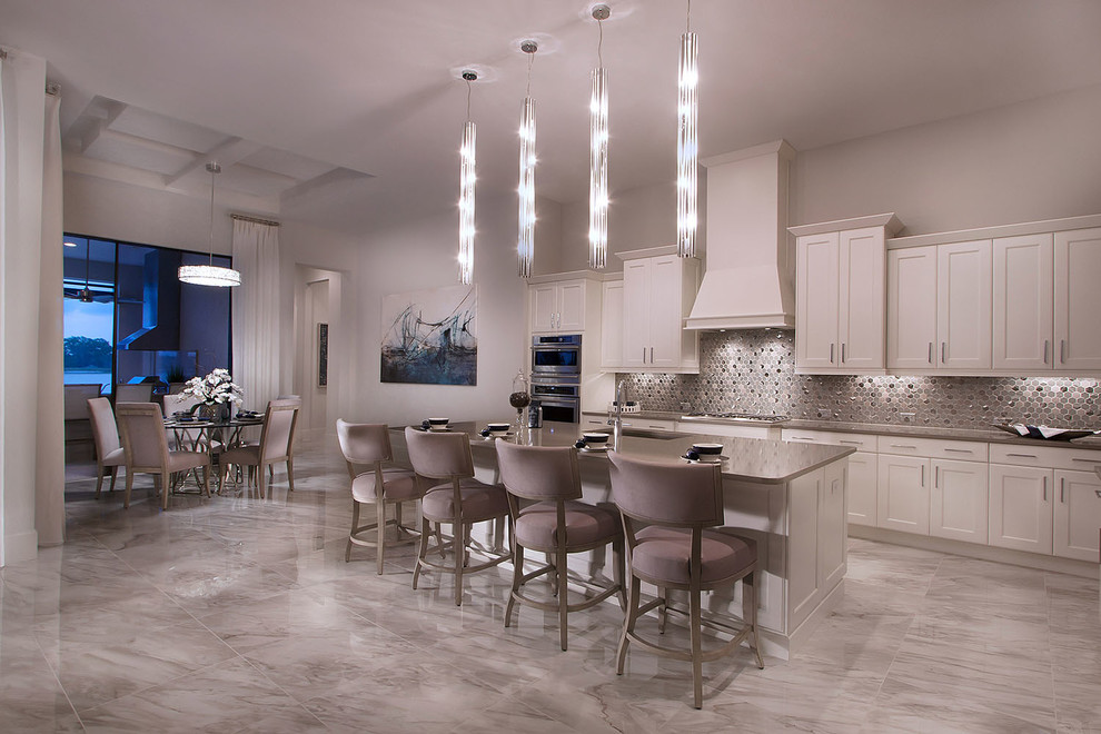 Inspiration for a mid-sized contemporary l-shaped marble floor and gray floor open concept kitchen remodel in Other with recessed-panel cabinets, gray cabinets, granite countertops, gray backsplash, ceramic backsplash, stainless steel appliances, an island and gray countertops