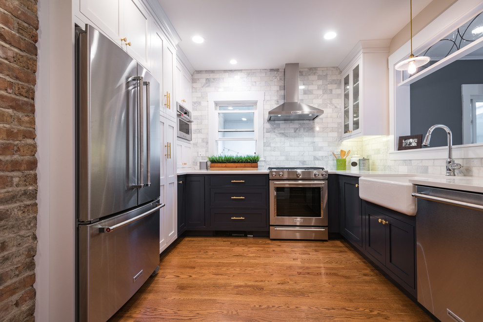 Enclosed kitchen - small transitional u-shaped medium tone wood floor and brown floor enclosed kitchen idea in Chicago with a farmhouse sink, beaded inset cabinets, white cabinets, quartz countertops, gray backsplash, marble backsplash, stainless steel appliances and no island