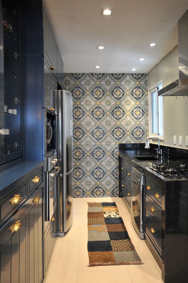 Transitional galley enclosed kitchen photo in Other with blue cabinets and stainless steel appliances