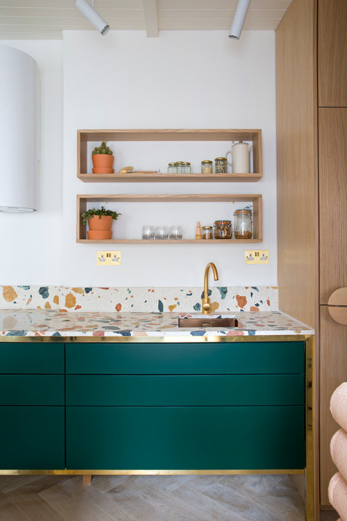 Elevating Dark Green Cabinetry with Terrazzo Backsplash and Countertop: Kitchen Shelf Ideas