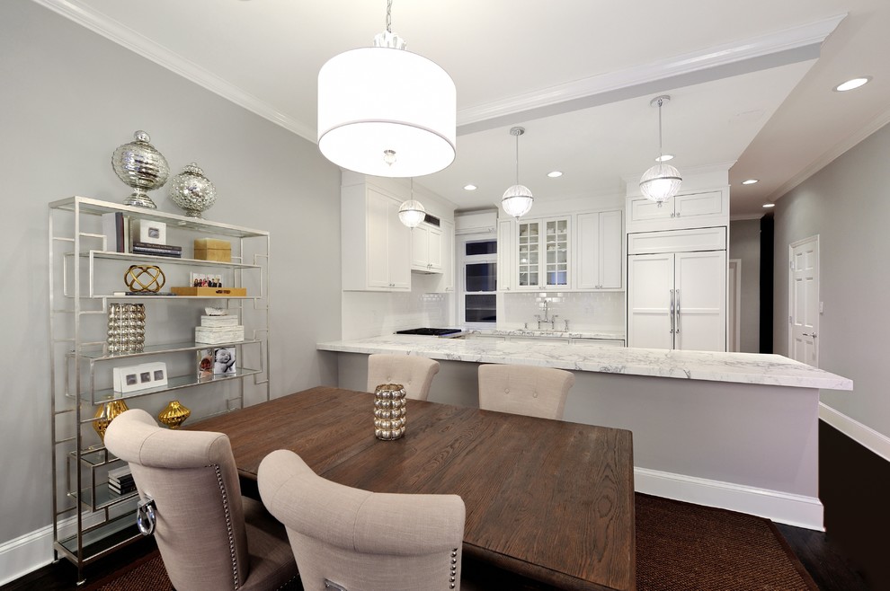 Example of a mid-sized trendy u-shaped dark wood floor eat-in kitchen design in New York with a single-bowl sink, recessed-panel cabinets, white cabinets, marble countertops, white backsplash, ceramic backsplash and stainless steel appliances