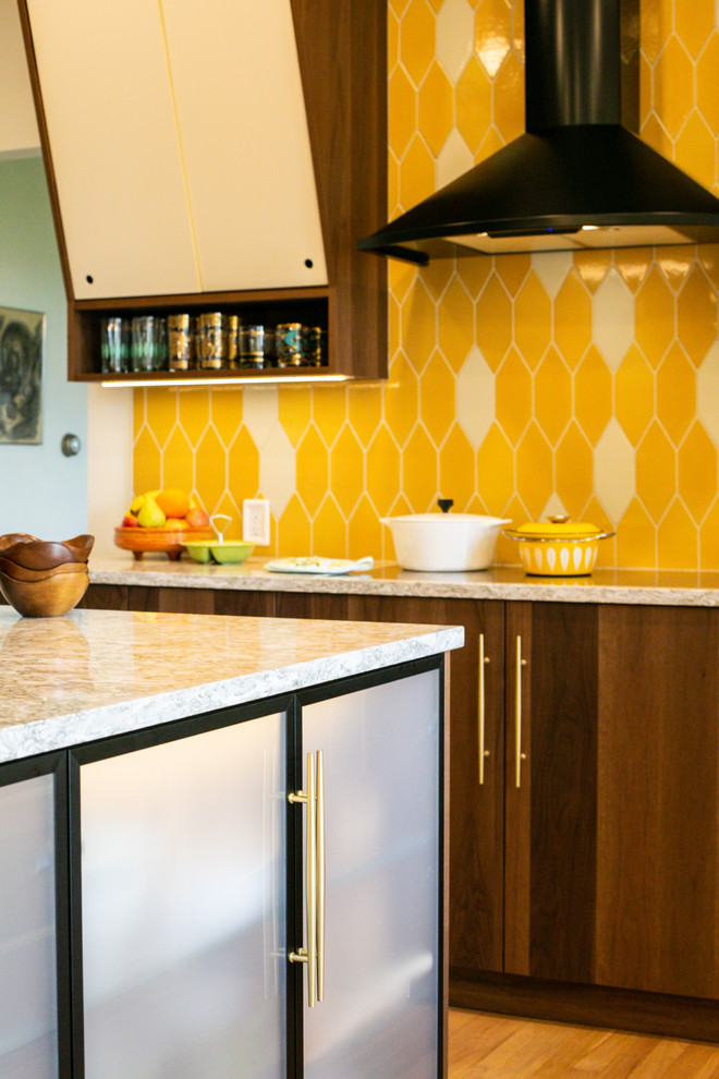 Mid-sized 1960s l-shaped light wood floor and brown floor eat-in kitchen photo in Denver with an undermount sink, flat-panel cabinets, medium tone wood cabinets, quartz countertops, yellow backsplash, ceramic backsplash, stainless steel appliances, an island and multicolored countertops