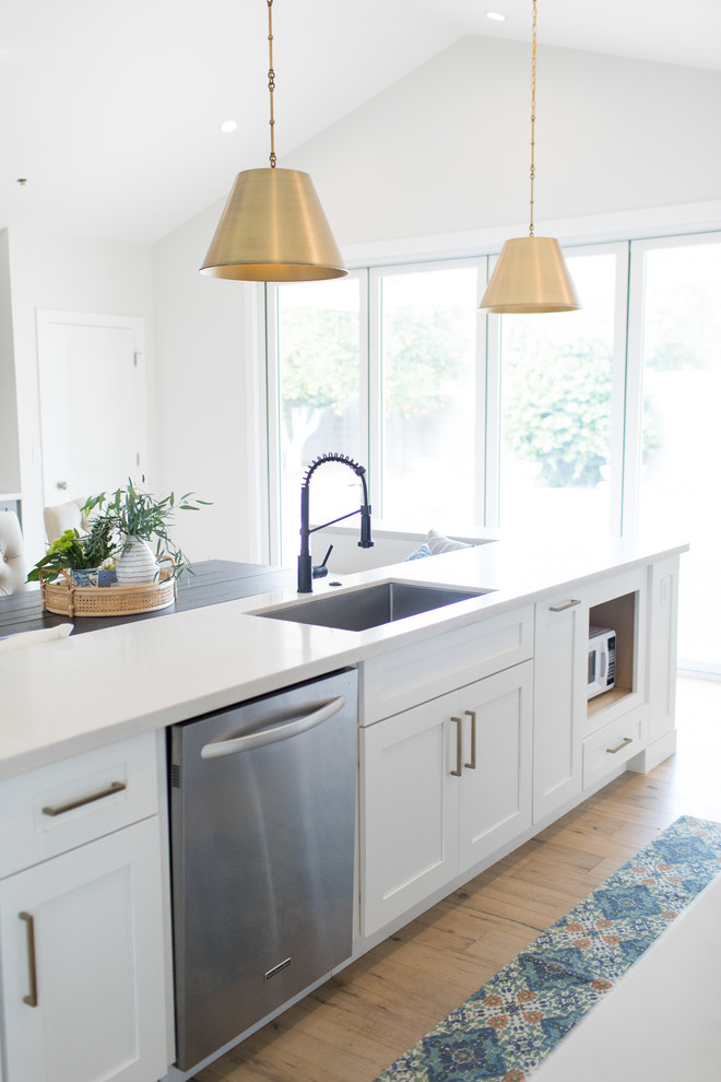 Inspiration for a large timeless u-shaped light wood floor and beige floor eat-in kitchen remodel in Phoenix with an undermount sink, shaker cabinets, gray cabinets, quartz countertops, multicolored backsplash, brick backsplash, stainless steel appliances, white countertops and an island