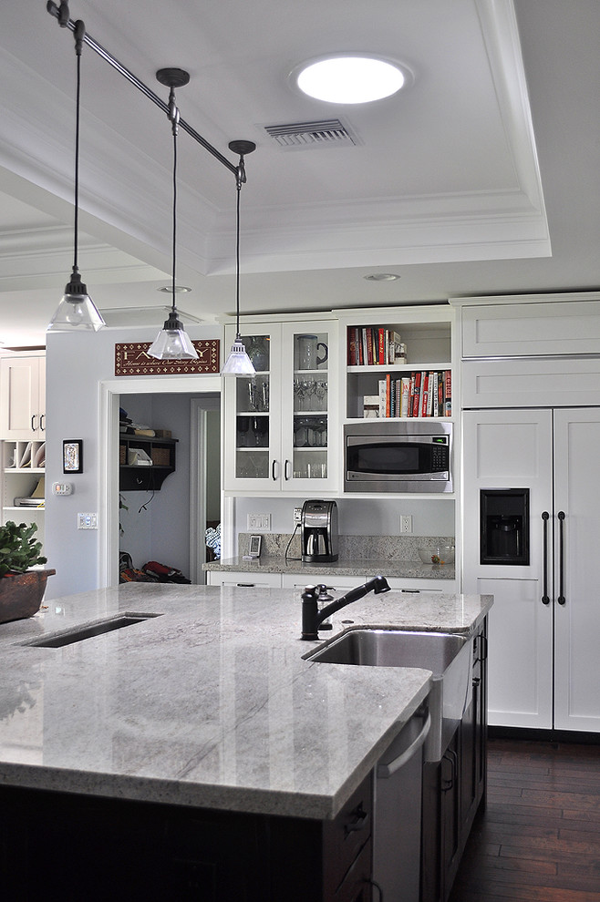Kitchen - traditional kitchen idea in Phoenix with shaker cabinets, a farmhouse sink, white cabinets, granite countertops and paneled appliances