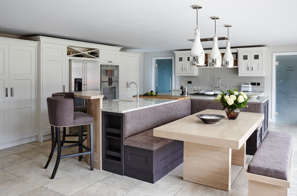 Large trendy l-shaped open concept kitchen photo in London with flat-panel cabinets, granite countertops, stainless steel appliances and an island