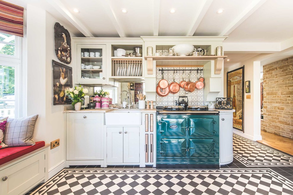 Country single-wall ceramic tile kitchen photo in Berkshire with a farmhouse sink, shaker cabinets, white cabinets, gray backsplash, ceramic backsplash, colored appliances and no island