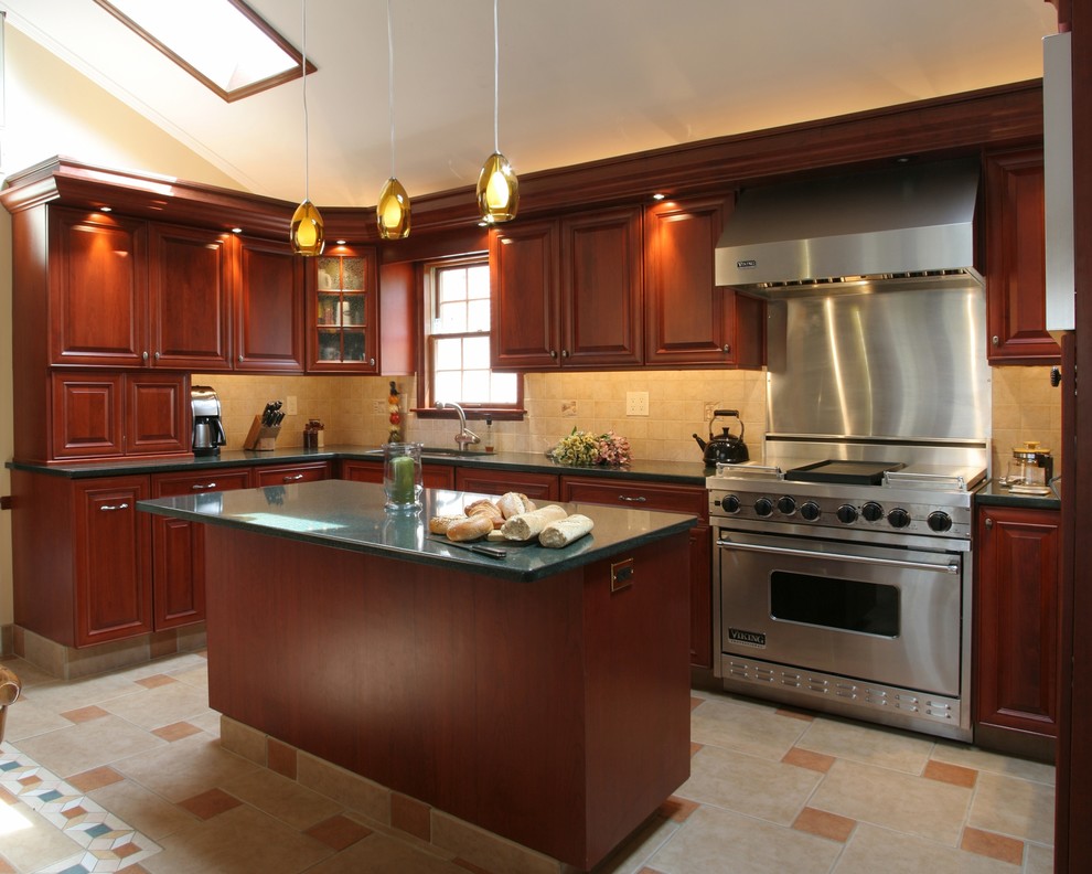 Eat-in kitchen - transitional l-shaped ceramic tile and beige floor eat-in kitchen idea in Other with a drop-in sink, raised-panel cabinets, medium tone wood cabinets, quartz countertops, beige backsplash, mosaic tile backsplash, stainless steel appliances and an island