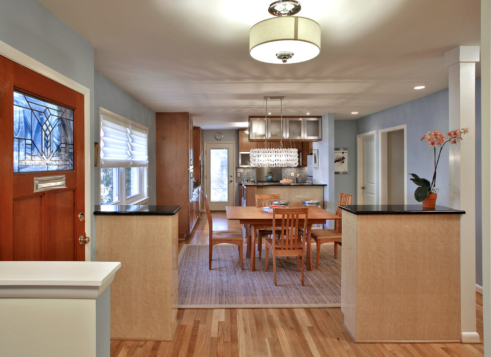 Inspiration for a small contemporary u-shaped light wood floor eat-in kitchen remodel in DC Metro with a single-bowl sink, recessed-panel cabinets, light wood cabinets, granite countertops, multicolored backsplash, glass tile backsplash, stainless steel appliances and a peninsula