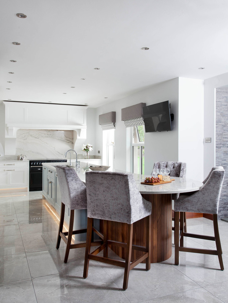 Photo of a medium sized traditional l-shaped open plan kitchen in Other with an integrated sink, shaker cabinets, blue cabinets, marble worktops, grey splashback, marble splashback, stainless steel appliances, porcelain flooring, an island and grey floors.