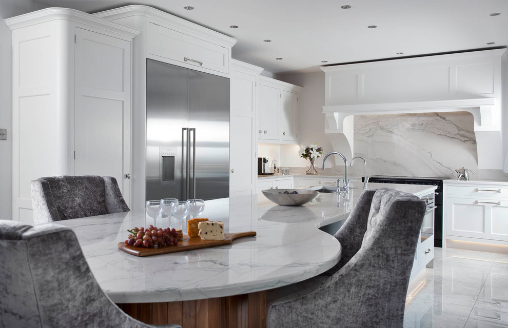 Design ideas for a medium sized traditional l-shaped open plan kitchen in Other with an integrated sink, shaker cabinets, blue cabinets, marble worktops, grey splashback, marble splashback, stainless steel appliances, porcelain flooring, an island and grey floors.