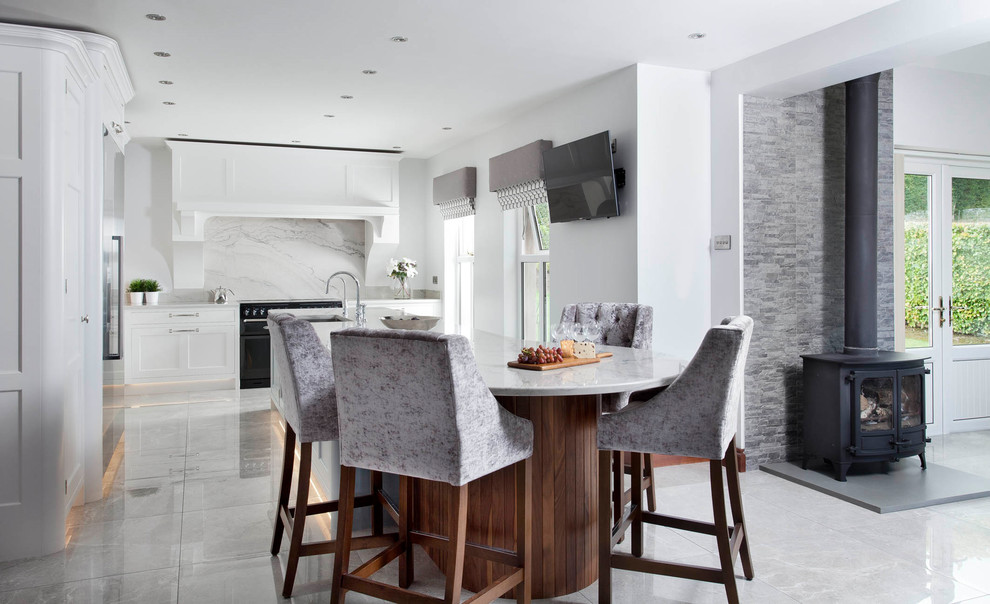 Inspiration for a medium sized traditional l-shaped open plan kitchen in Other with an integrated sink, shaker cabinets, blue cabinets, marble worktops, grey splashback, marble splashback, stainless steel appliances, porcelain flooring, an island and grey floors.