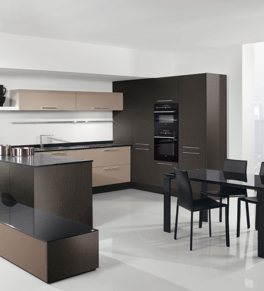 Example of a mid-sized minimalist u-shaped concrete floor and white floor eat-in kitchen design in Other with a drop-in sink, flat-panel cabinets, dark wood cabinets, quartz countertops, black appliances, a peninsula and black countertops