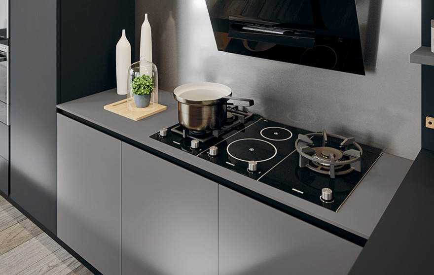 Immagine di una grande cucina minimal con ante grigie, elettrodomestici in acciaio inossidabile e pavimento in legno massello medio