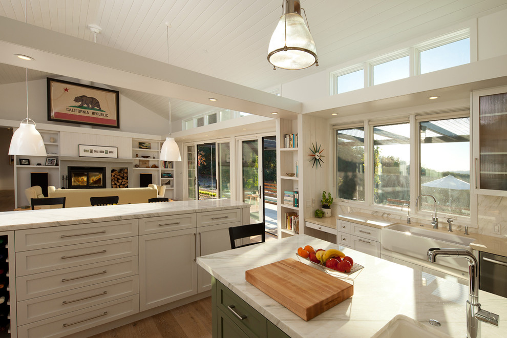 Inspiration for a country u-shaped open plan kitchen in San Luis Obispo with a belfast sink, recessed-panel cabinets, white cabinets, marble worktops, multi-coloured splashback, stone slab splashback and stainless steel appliances.
