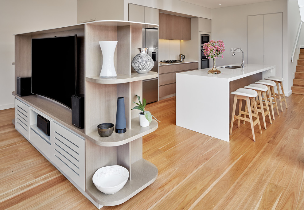 Design ideas for a medium sized contemporary single-wall kitchen/diner in Sydney with a double-bowl sink, brown cabinets, ceramic splashback, stainless steel appliances, medium hardwood flooring and an island.