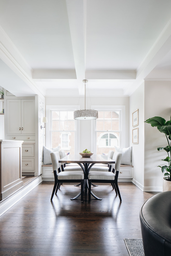 Open concept kitchen - mid-sized traditional open concept kitchen idea in Chicago with shaker cabinets, white cabinets, quartz countertops, white backsplash, ceramic backsplash, stainless steel appliances, an island and white countertops