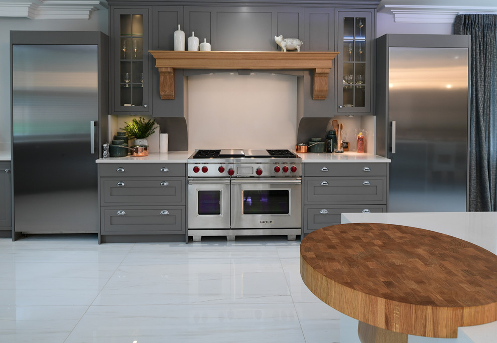 Kitchen - contemporary porcelain tile and beige floor kitchen idea in London