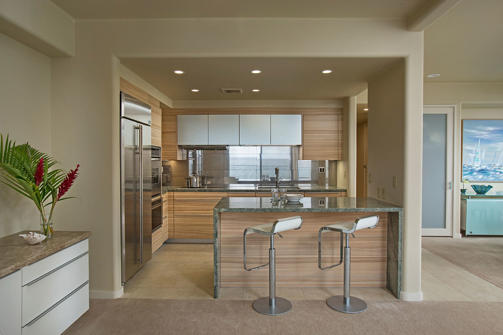 Photo of a contemporary kitchen in Hawaii with a single-bowl sink, flat-panel cabinets, medium wood cabinets, granite worktops, metallic splashback, porcelain splashback, stainless steel appliances, porcelain flooring and green worktops.