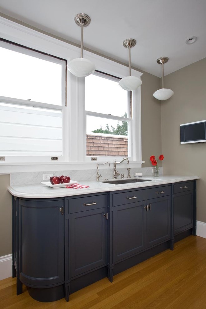 Kitchen - traditional kitchen idea in San Francisco with an undermount sink, recessed-panel cabinets and black cabinets