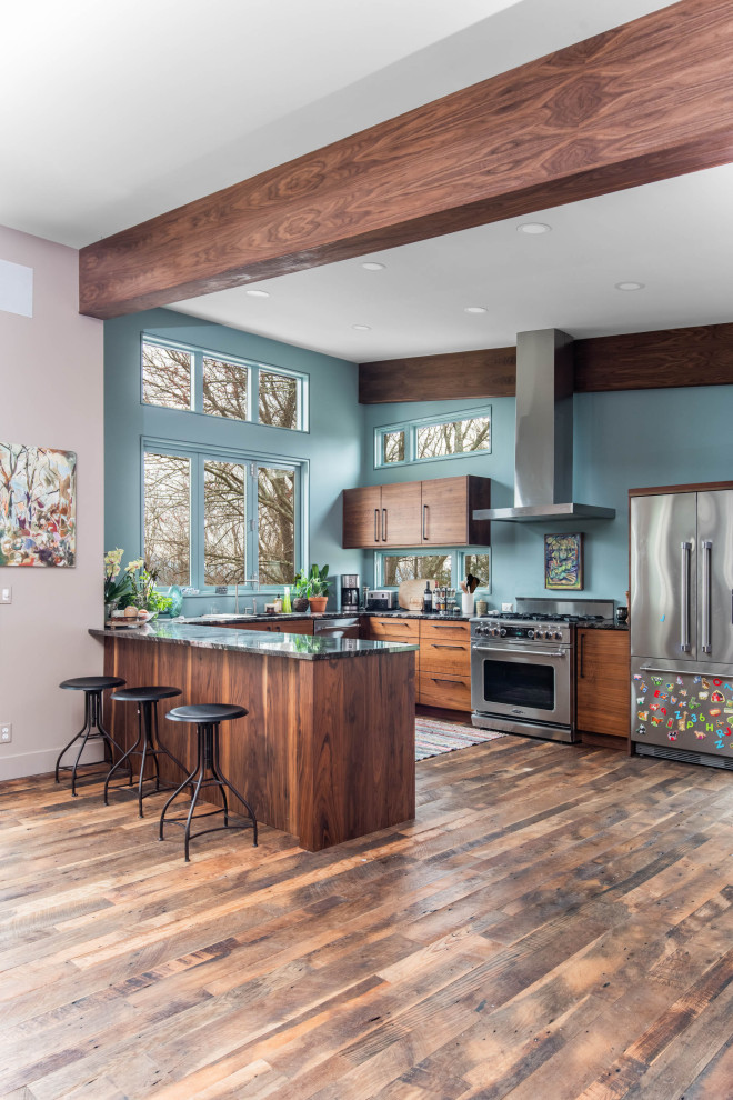 Example of a small trendy u-shaped dark wood floor, brown floor and exposed beam eat-in kitchen design in Other with an undermount sink, flat-panel cabinets, dark wood cabinets, quartzite countertops, stainless steel appliances, a peninsula and multicolored countertops