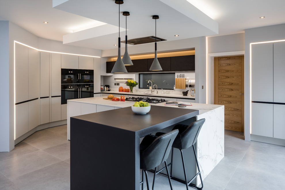 Design ideas for a large contemporary kitchen in West Midlands with a single-bowl sink, composite countertops, white splashback, marble splashback, coloured appliances, porcelain flooring, an island, grey floors, flat-panel cabinets, white cabinets and white worktops.
