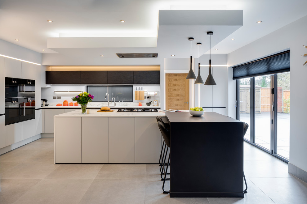 Design ideas for a large contemporary open plan kitchen in West Midlands with a single-bowl sink, grey cabinets, composite countertops, white splashback, marble splashback, coloured appliances, porcelain flooring, an island and grey floors.