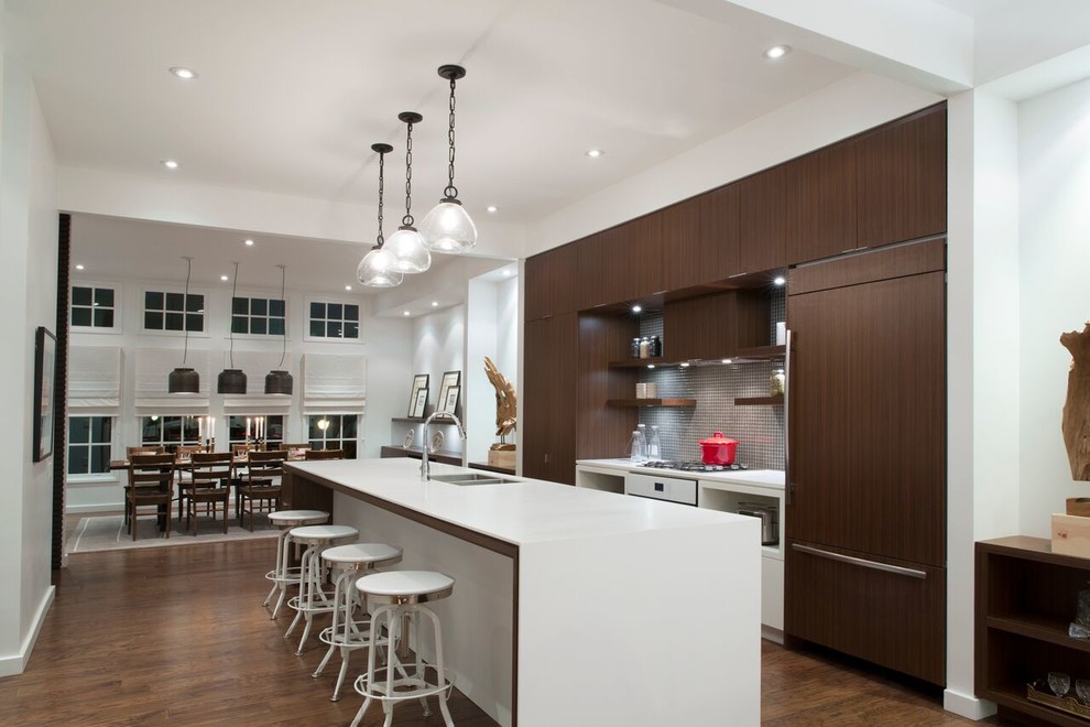 Open concept kitchen - large contemporary galley dark wood floor open concept kitchen idea in Atlanta with a drop-in sink, flat-panel cabinets, dark wood cabinets, marble countertops, gray backsplash, mosaic tile backsplash, white appliances and an island