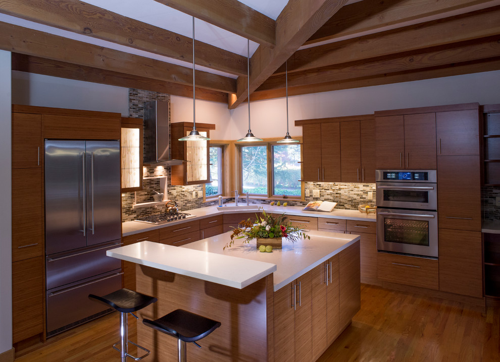 Eat-in kitchen - large l-shaped light wood floor eat-in kitchen idea in San Francisco with medium tone wood cabinets, multicolored backsplash, an island, an undermount sink, shaker cabinets, marble countertops, glass sheet backsplash and stainless steel appliances
