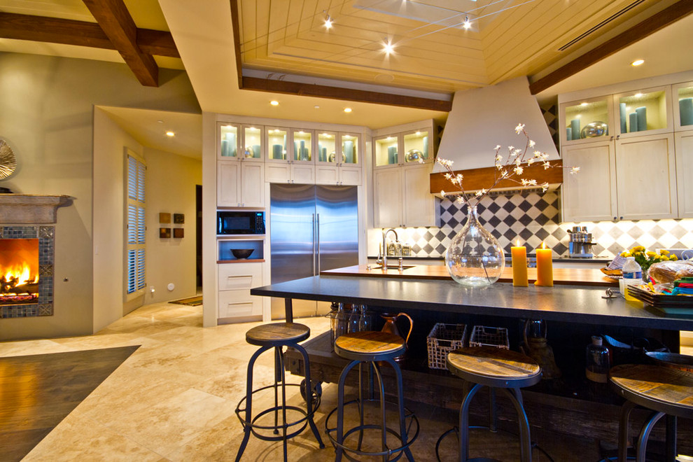 Design ideas for a large traditional open plan kitchen in Phoenix with a submerged sink, shaker cabinets, white cabinets, engineered stone countertops, cement tile splashback, stainless steel appliances, travertine flooring and an island.