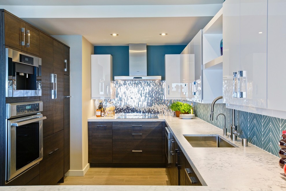 Mid-sized trendy l-shaped porcelain tile eat-in kitchen photo in San Diego with a single-bowl sink, recessed-panel cabinets, dark wood cabinets, quartz countertops, blue backsplash, mosaic tile backsplash, stainless steel appliances and no island
