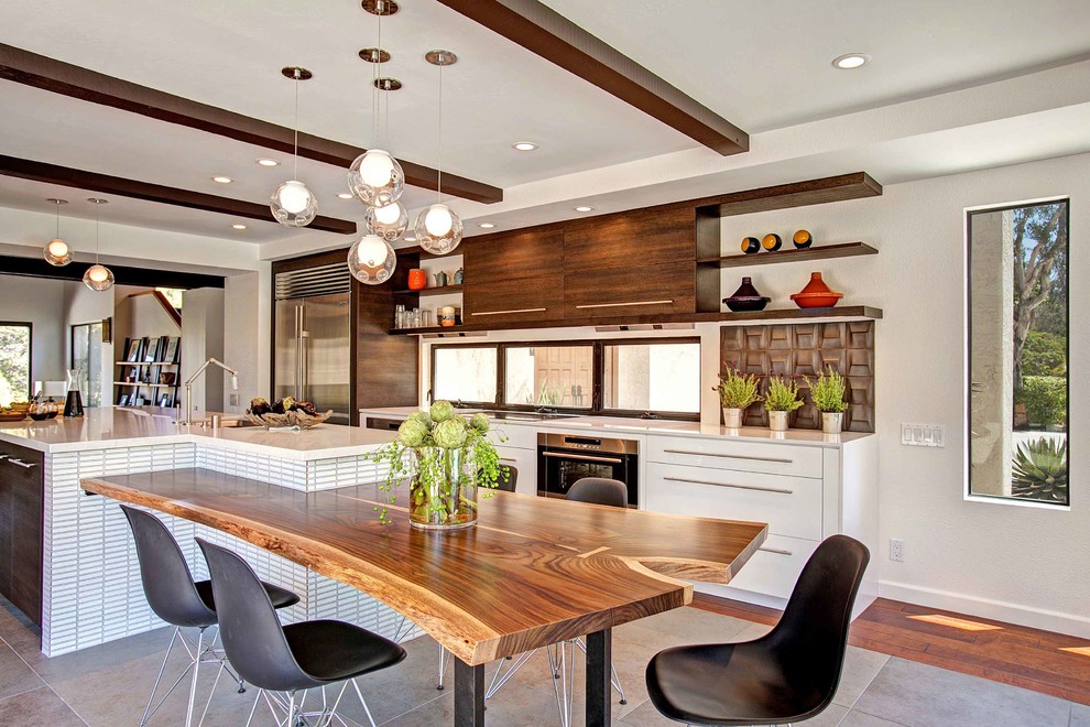 Example of a mid-sized trendy medium tone wood floor kitchen pantry design in San Diego with flat-panel cabinets, medium tone wood cabinets, quartz countertops, stainless steel appliances and an island