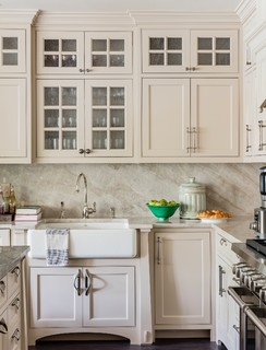 Closeup of classic cream-colored kitchen with appliances Stock Photo by  staRRush