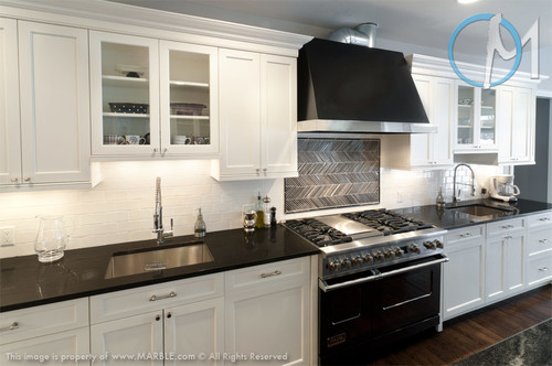 Contemporary New York kitchen featuring absolute black leathered granite