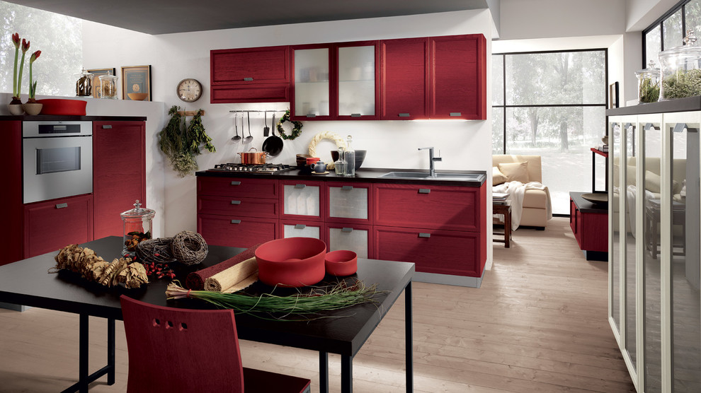 Design ideas for a medium sized modern l-shaped kitchen/diner in Melbourne with a double-bowl sink, raised-panel cabinets, red cabinets, quartz worktops, stainless steel appliances, medium hardwood flooring and multiple islands.