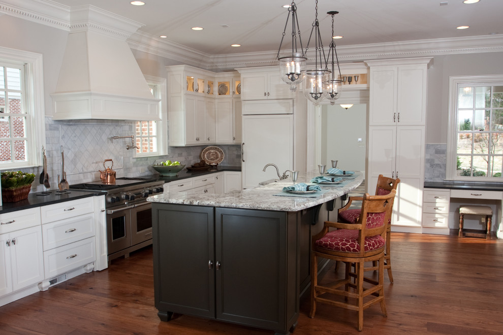 Inspiration for a large timeless u-shaped dark wood floor and brown floor eat-in kitchen remodel in Atlanta with recessed-panel cabinets, white cabinets, granite countertops, gray backsplash, marble backsplash, stainless steel appliances, an island, black countertops and a farmhouse sink