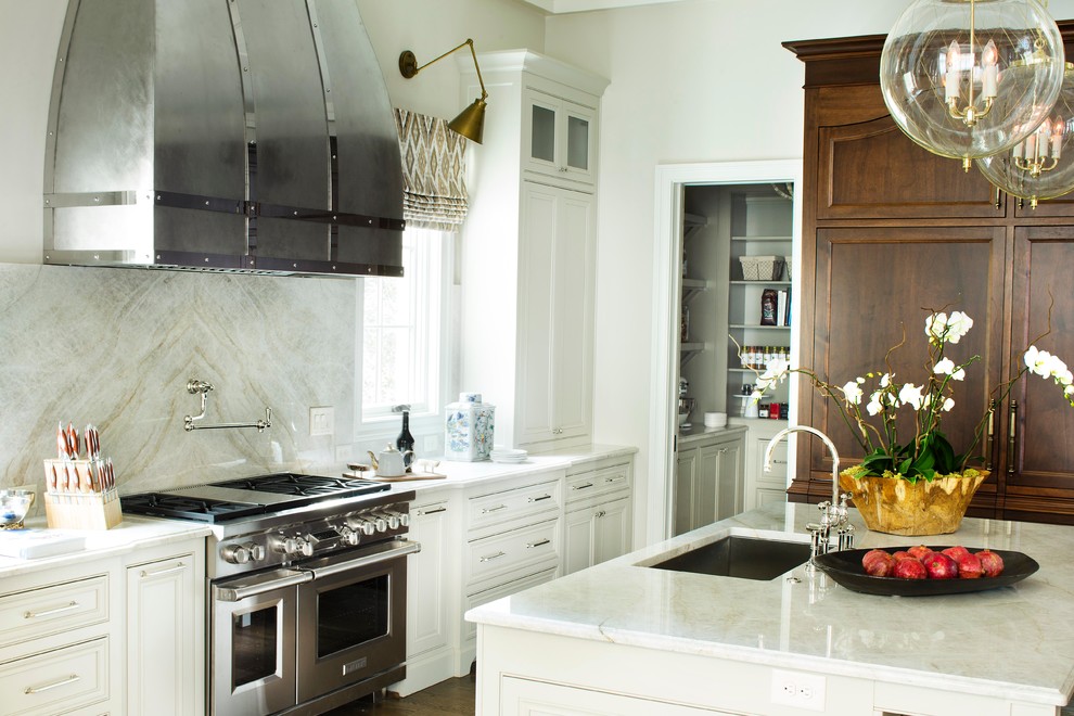 Kitchen - traditional kitchen idea in Atlanta with quartzite countertops and an island