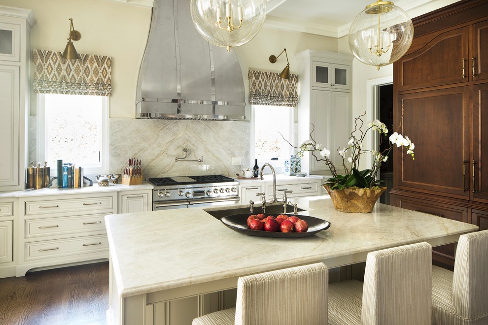Example of a classic kitchen design in Atlanta with quartzite countertops and an island