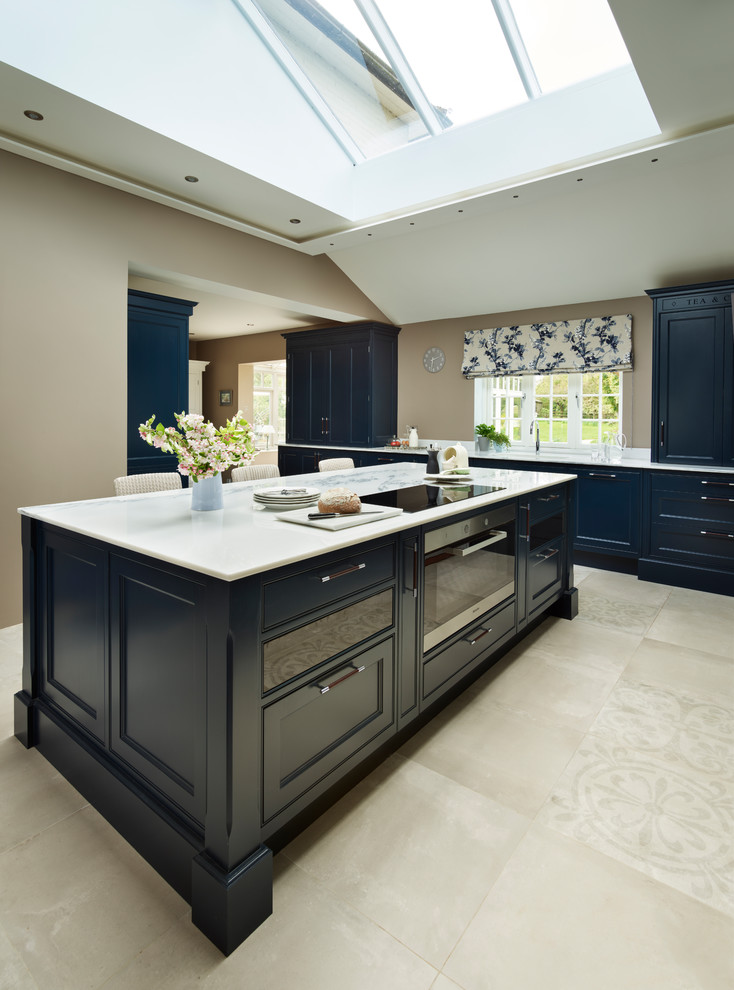 Inspiration for a large classic kitchen in Essex with beaded cabinets, blue cabinets, marble worktops, white appliances and an island.