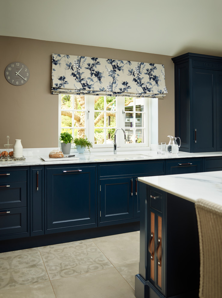Inspiration for a large classic kitchen in Essex with beaded cabinets, blue cabinets, marble worktops, white appliances and an island.