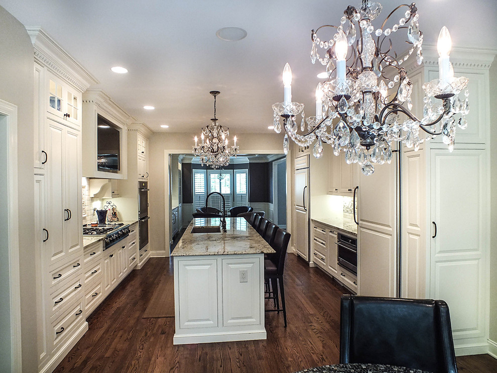 Large elegant galley dark wood floor eat-in kitchen photo in Cleveland with a single-bowl sink, raised-panel cabinets, white cabinets, granite countertops, white backsplash, glass tile backsplash, stainless steel appliances and an island