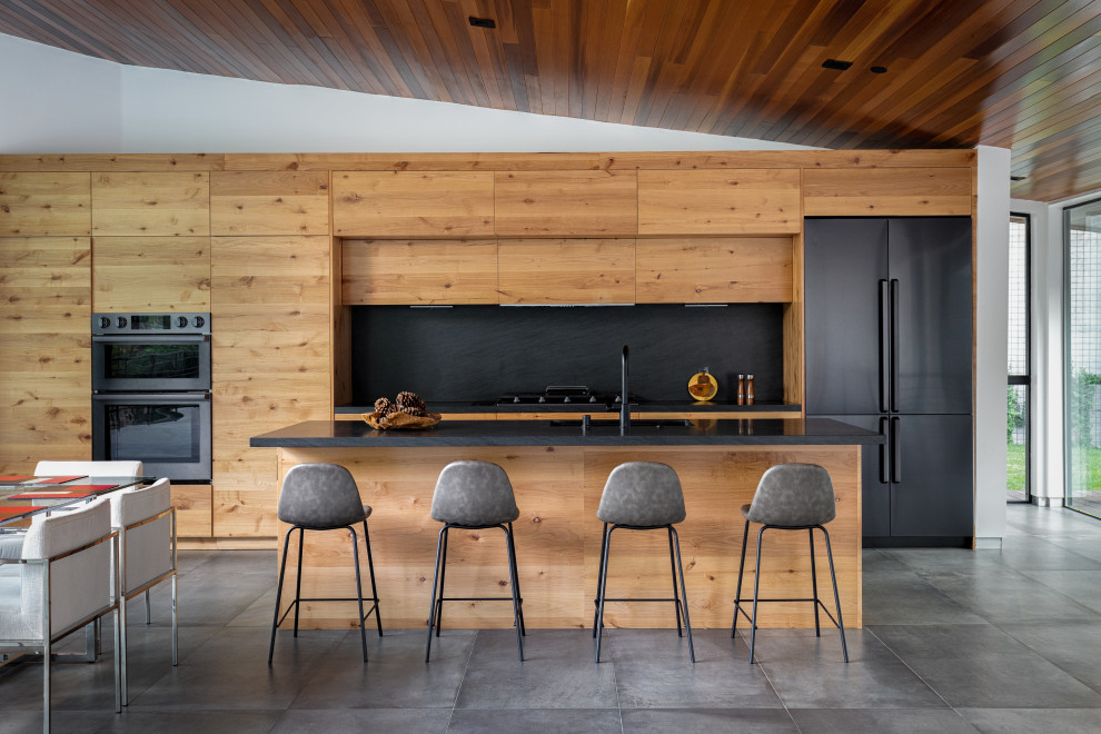 Idées déco pour une cuisine contemporaine avec un plafond en bois.