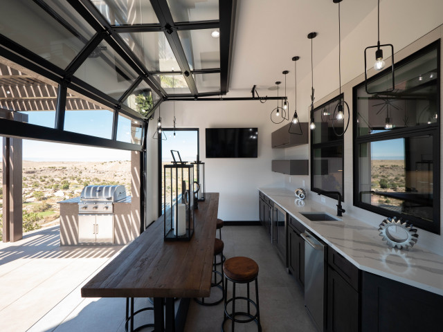 Award Winning indoor-outdoor Kitchen with Glass Garage Door - Modern