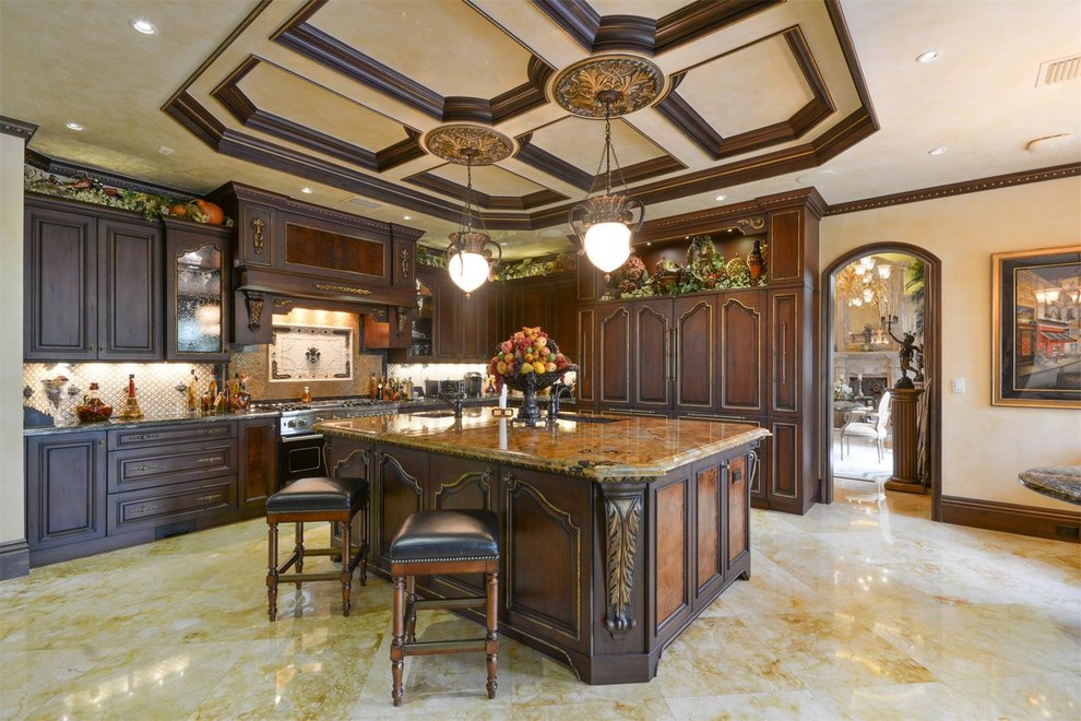 Mid-sized tuscan l-shaped marble floor and multicolored floor open concept kitchen photo in Miami with an integrated sink, recessed-panel cabinets, dark wood cabinets, granite countertops, white backsplash, stone tile backsplash, an island and black appliances