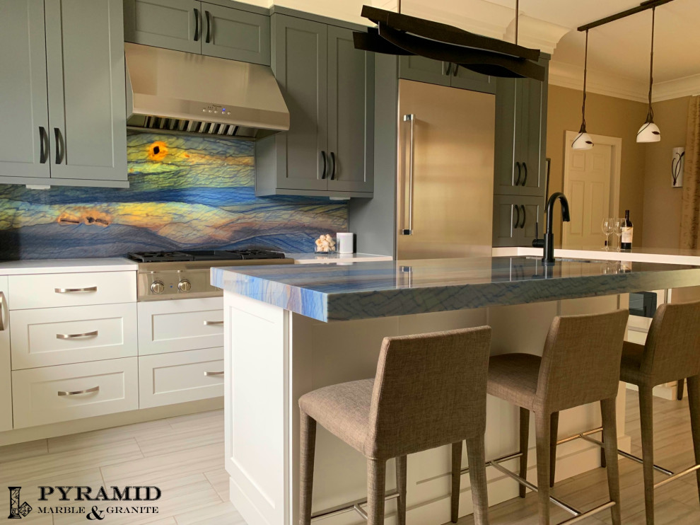 Example of a mid-sized tuscan light wood floor and beige floor eat-in kitchen design in Chicago with an undermount sink, white cabinets, quartzite countertops, blue backsplash, stone slab backsplash, stainless steel appliances, an island and blue countertops