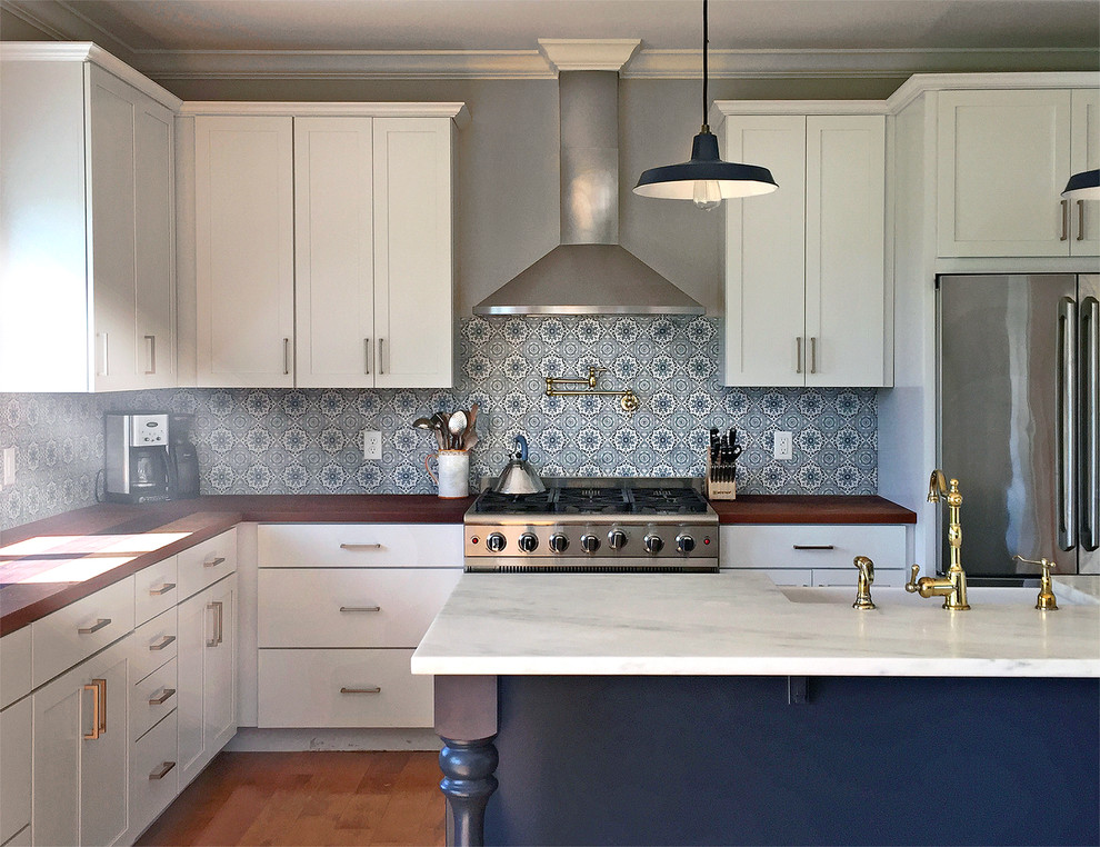 Design ideas for a traditional kitchen in Burlington with blue splashback and marble splashback.